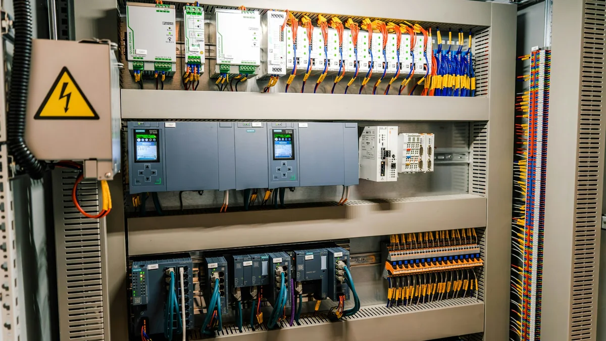 Industrial control cabinet with wired modules