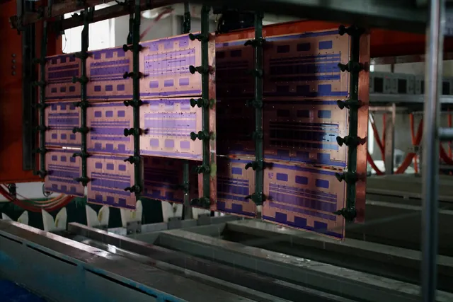 PCB panels suspended in an electroplating production line