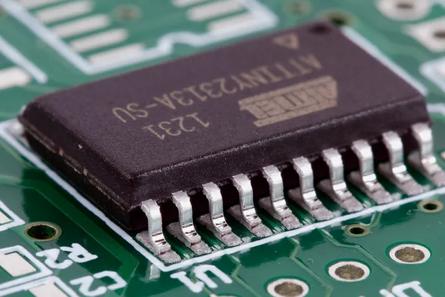 Fine-pitch integrated circuit solder joints on a green PCB