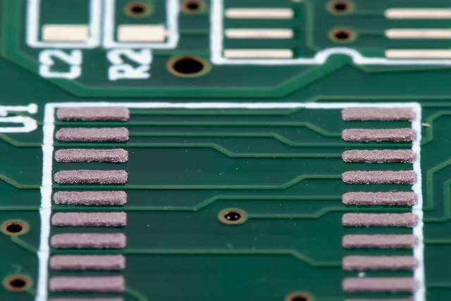 Stencil-printed solder paste deposits on PCB pads