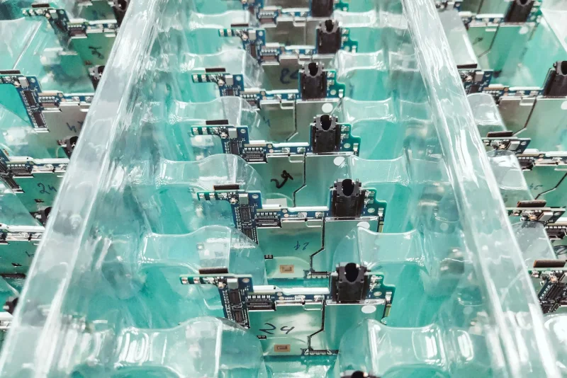 Repeated assembled PCBAs separated in protective production trays for batch inspection