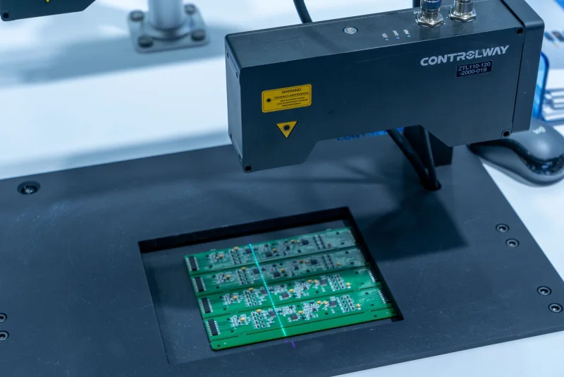 Laser-based optical inspection station scanning populated PCBA panels
