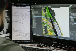 Electronics concept design with circuit schematic and product structure model on screen